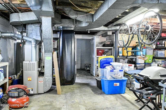 unfinished basement featuring heating unit