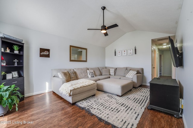 living area featuring lofted ceiling, ceiling fan, wood finished floors, and baseboards