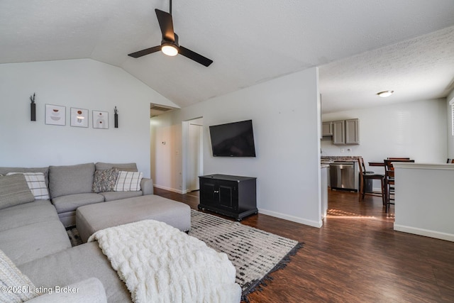 living room with baseboards, lofted ceiling, dark wood-style floors, ceiling fan, and a textured ceiling