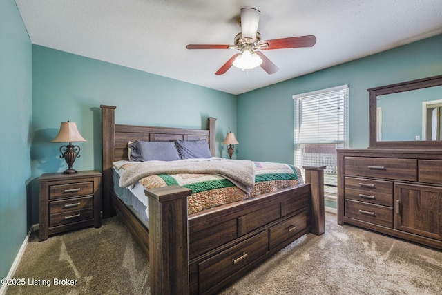 bedroom featuring a ceiling fan, baseboards, and carpet flooring