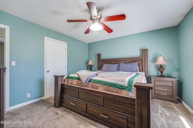 bedroom featuring ceiling fan, baseboards, and light colored carpet