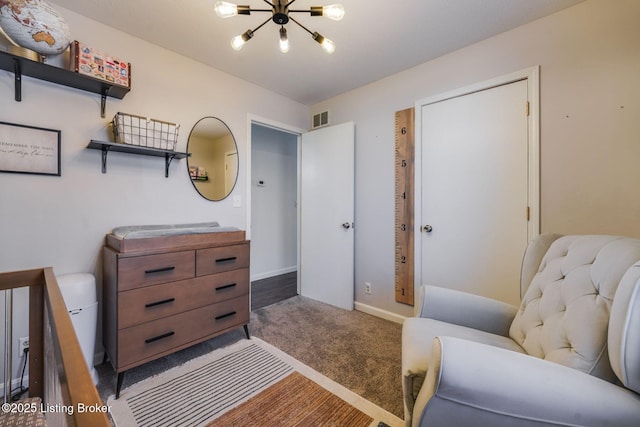 living area with baseboards, carpet, visible vents, and an inviting chandelier