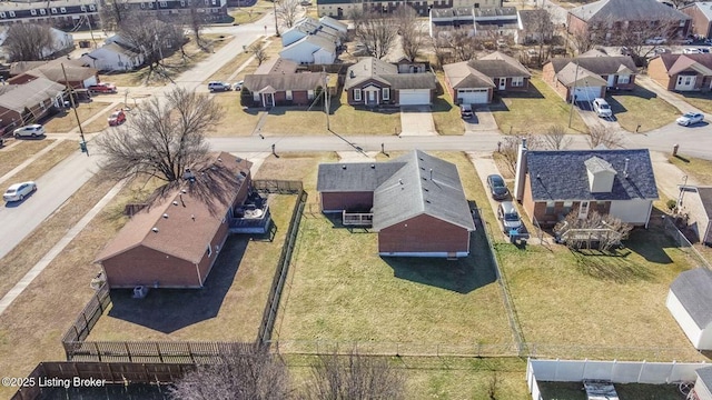 birds eye view of property with a residential view