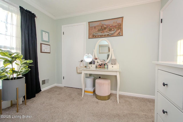 carpeted office space featuring ornamental molding, visible vents, and baseboards