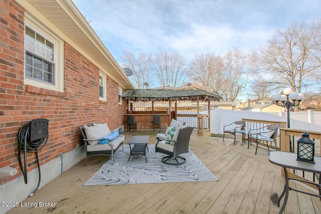 deck with fence and an outdoor living space