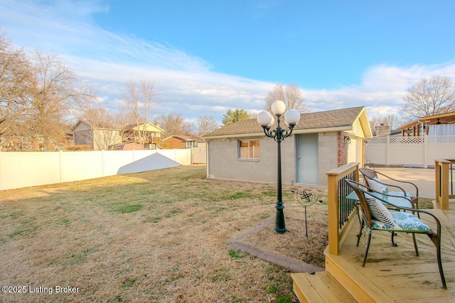 view of yard featuring a fenced backyard and an outdoor structure