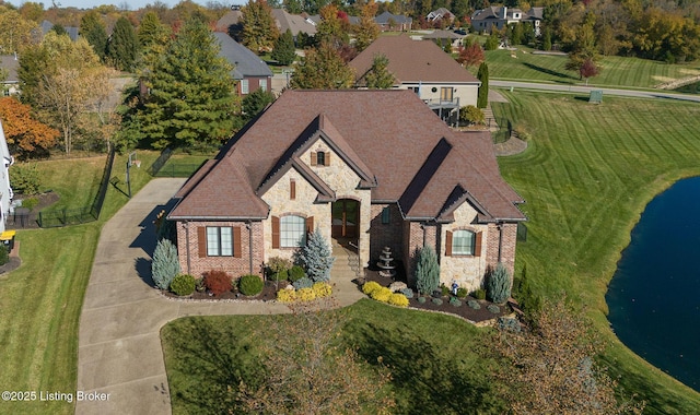 view of front of home featuring stone siding, brick siding, and roof with shingles