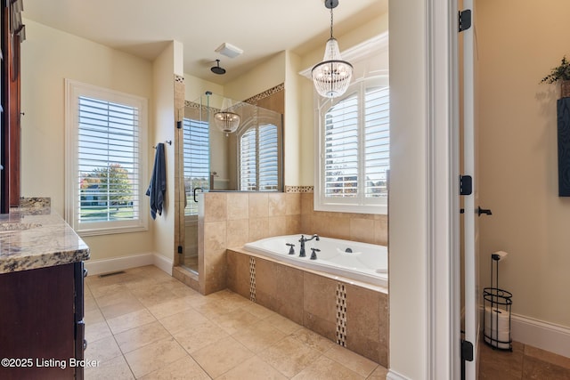 full bath featuring visible vents, an inviting chandelier, vanity, a shower stall, and tile patterned flooring