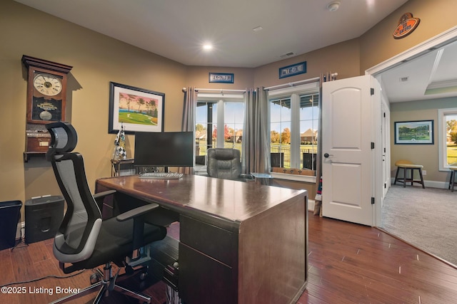 office space featuring dark wood-style floors, recessed lighting, visible vents, and baseboards