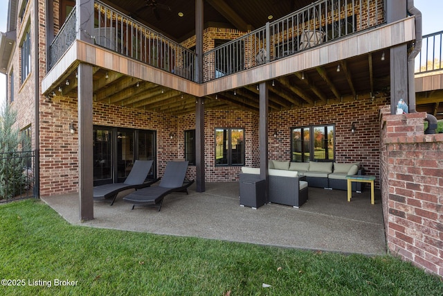 view of patio featuring outdoor lounge area and a balcony