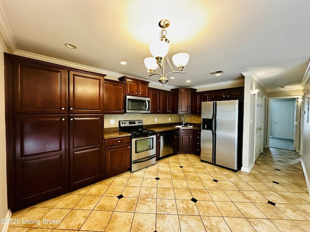 743 N Hite Ave Unit 4, Louisville, KY 40206 - kitchen with appliances with stainless steel finishes, a sink, a chandelier, ornamental molding, and light tile patterned flooring