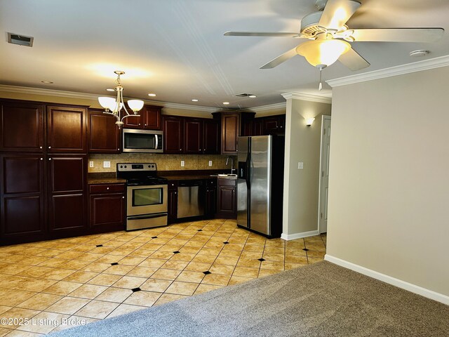 743 N Hite Ave Unit 4, Louisville, KY 40206 - kitchen with appliances with stainless steel finishes, a chandelier, dark countertops, backsplash, and hanging light fixtures