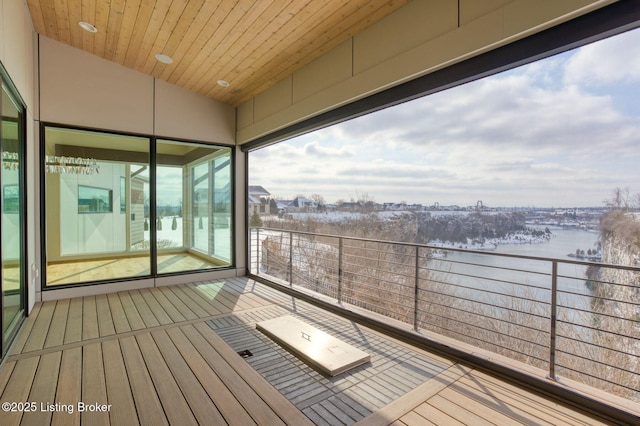 wooden deck with a water view