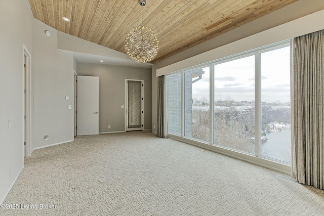 empty room featuring wooden ceiling, recessed lighting, light carpet, baseboards, and an inviting chandelier