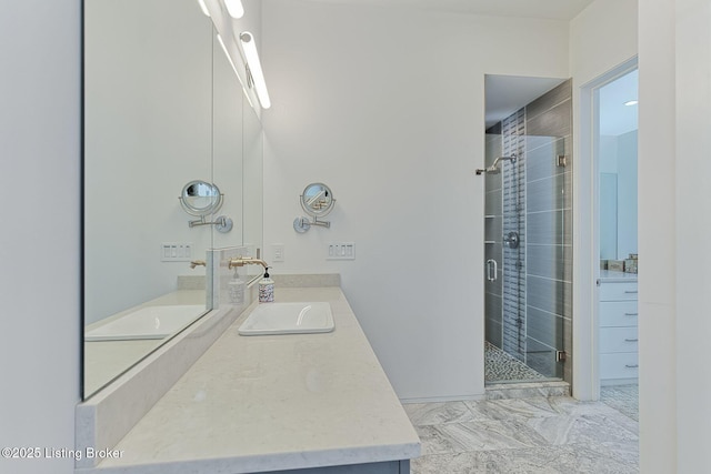 full bath featuring a stall shower and vanity