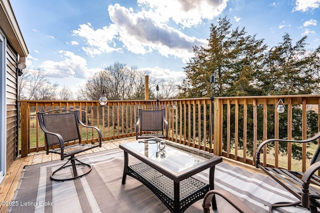 deck with outdoor dining area