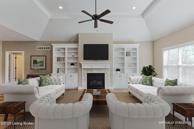 living room with ceiling fan, recessed lighting, a fireplace, visible vents, and vaulted ceiling