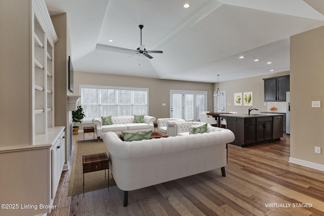 living room with ceiling fan, dark wood-type flooring, baseboards, and recessed lighting