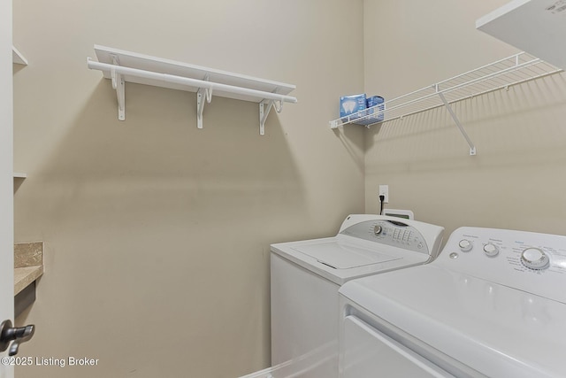 laundry area featuring laundry area and washing machine and clothes dryer