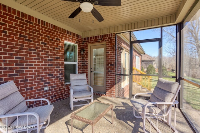 sunroom with wooden ceiling and ceiling fan