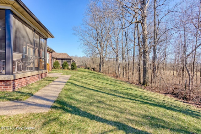 view of yard with a sunroom