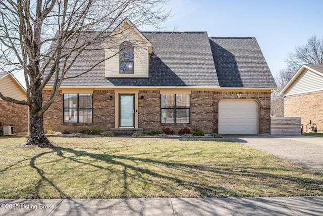 cape cod house featuring brick siding, roof with shingles, a front yard, a garage, and driveway