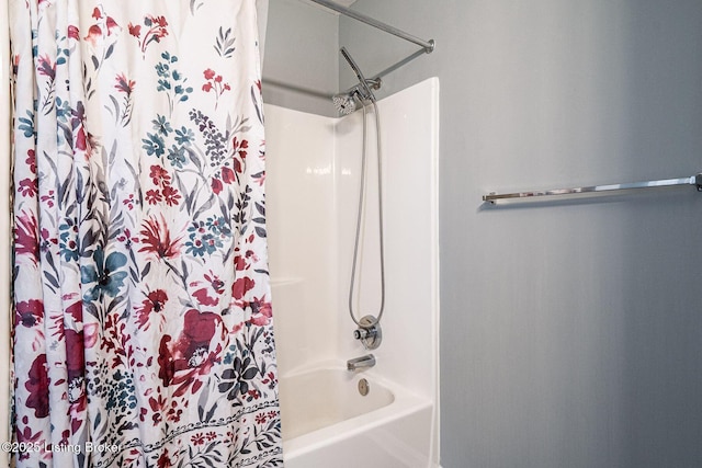 bathroom featuring shower / tub combo with curtain