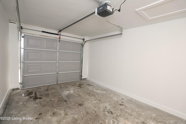 garage featuring baseboards and a garage door opener