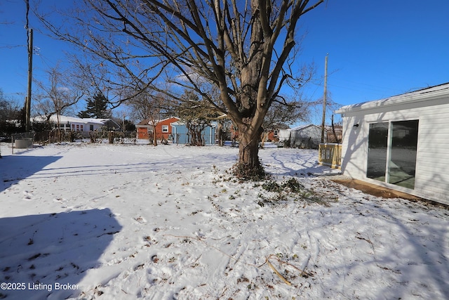 view of yard covered in snow