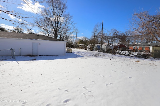 view of yard layered in snow