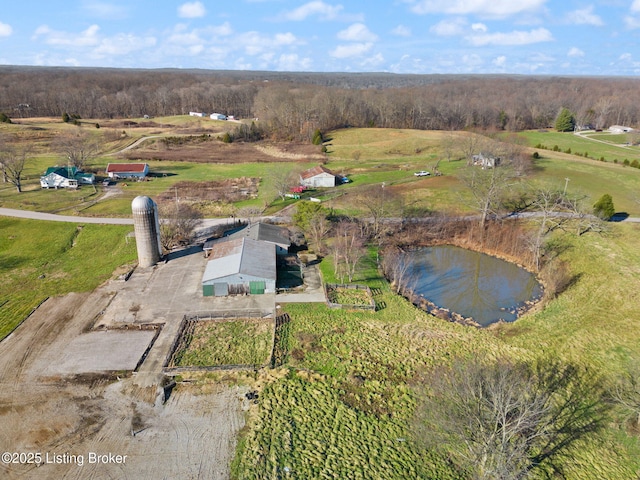 bird's eye view featuring a rural view and a water view