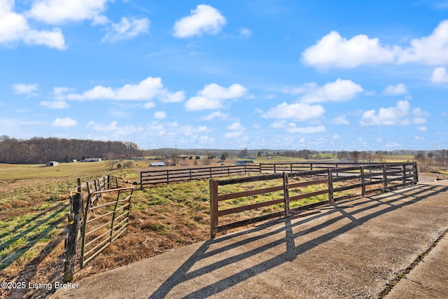 view of gate with a rural view