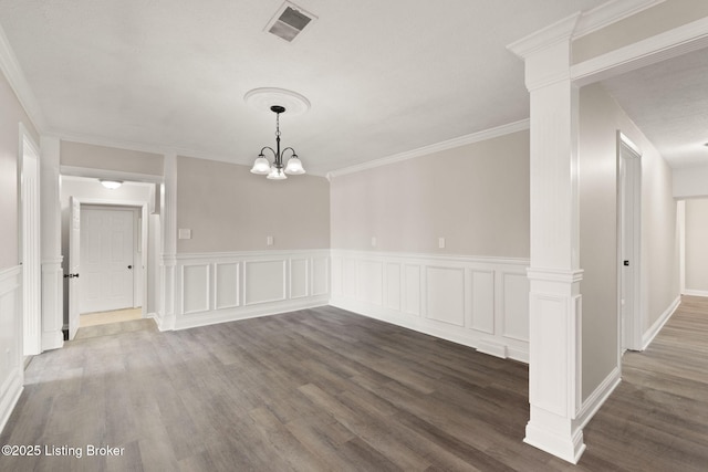 unfurnished dining area with ornamental molding, dark wood-type flooring, visible vents, and a notable chandelier