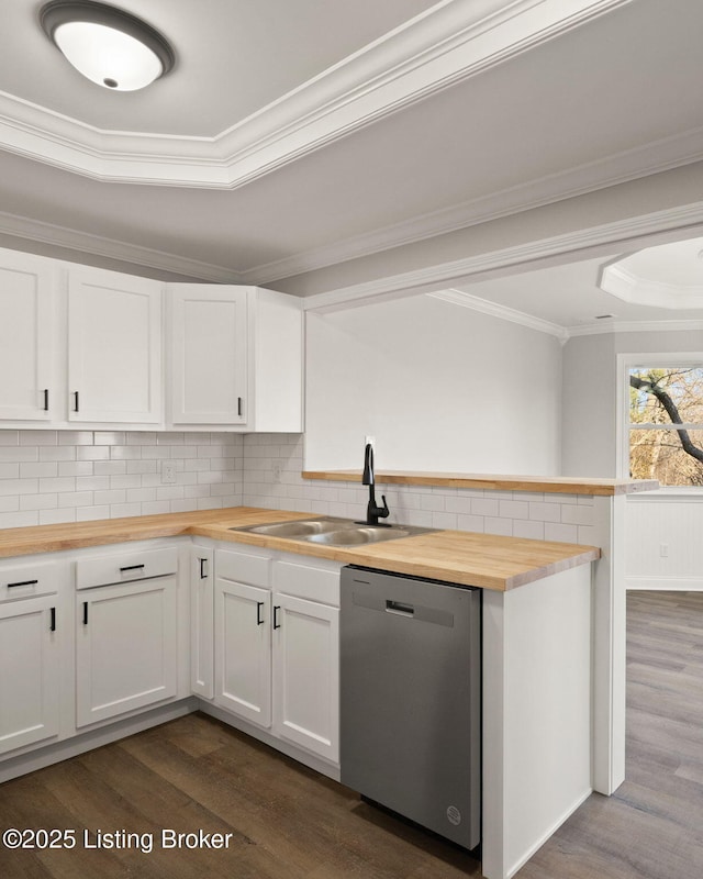 kitchen with butcher block counters, dark wood-type flooring, white cabinetry, a sink, and dishwasher