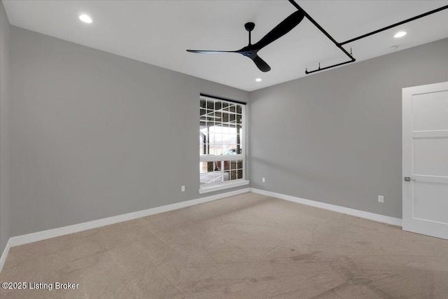 empty room with recessed lighting, light carpet, ceiling fan, and baseboards