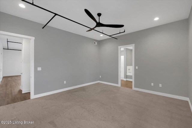 unfurnished bedroom with recessed lighting, carpet flooring, visible vents, and baseboards