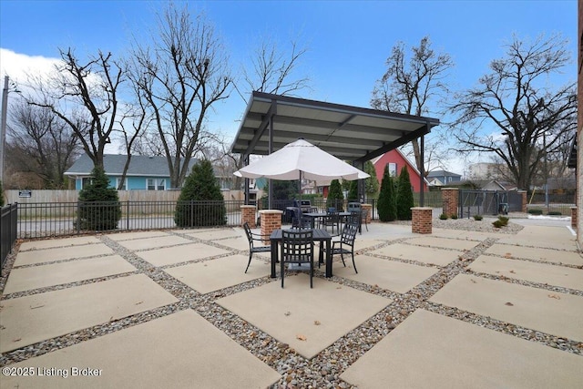 view of patio / terrace featuring outdoor dining area and fence