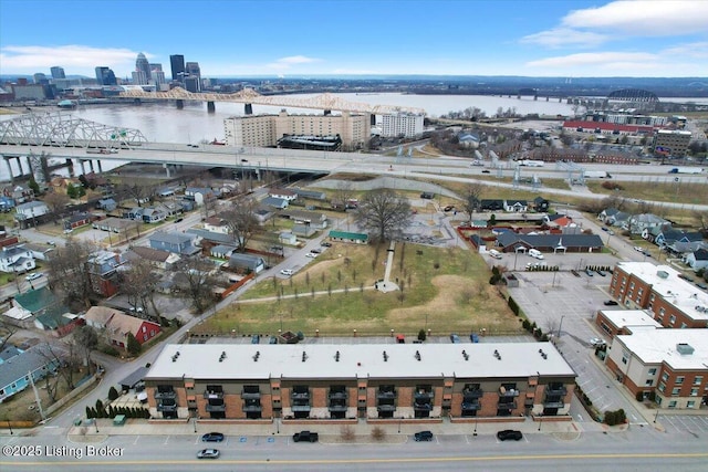 birds eye view of property with a view of city and a water view