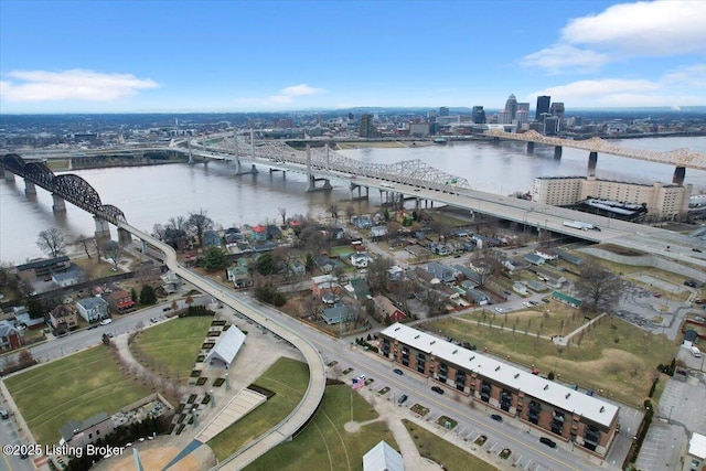 birds eye view of property with a water view and a city view