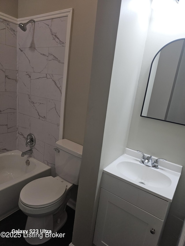 bathroom featuring bathing tub / shower combination, toilet, and vanity