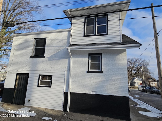 view of home's exterior featuring brick siding