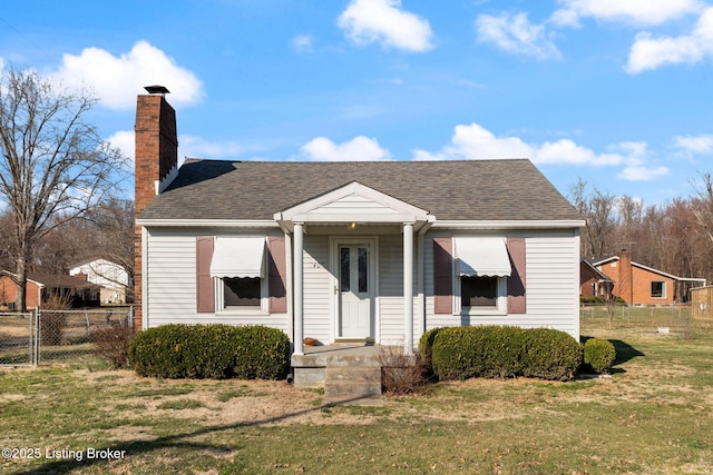 bungalow with fence, roof with shingles, a front yard, a chimney, and a gate