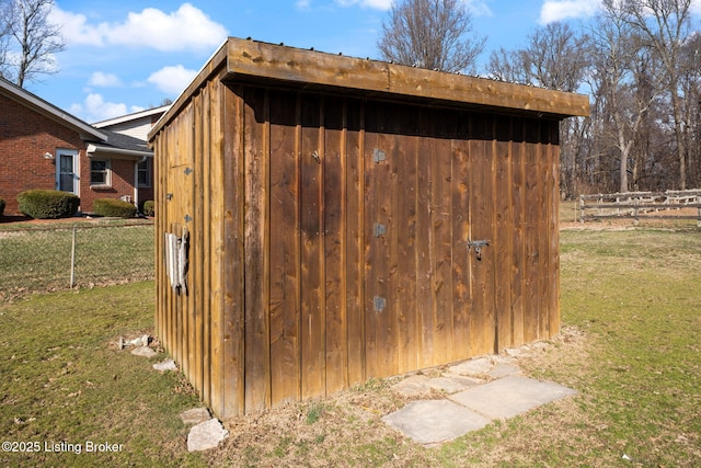 view of outdoor structure featuring an outdoor structure and fence