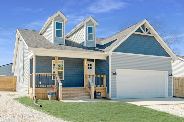 view of front facade featuring a porch, a shingled roof, a front yard, fence, and a garage