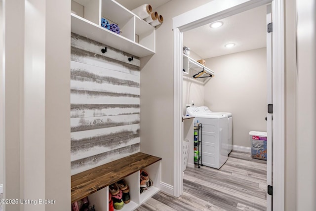 mudroom with recessed lighting, baseboards, wood finished floors, and independent washer and dryer