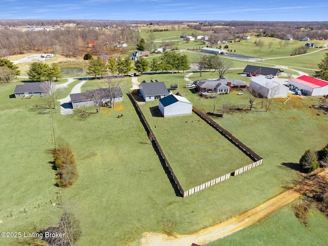 birds eye view of property featuring a rural view