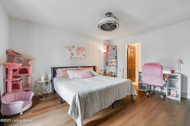 bedroom featuring wood finished floors