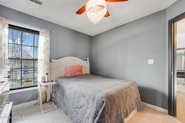 bedroom featuring a ceiling fan, baseboards, and carpet flooring