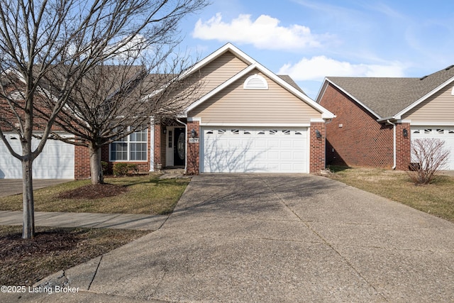 view of front of property with a garage, concrete driveway, and brick siding