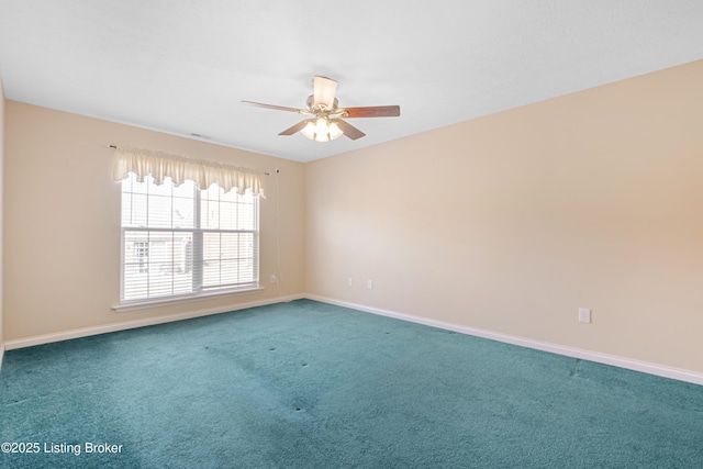 empty room with a ceiling fan, carpet, and baseboards